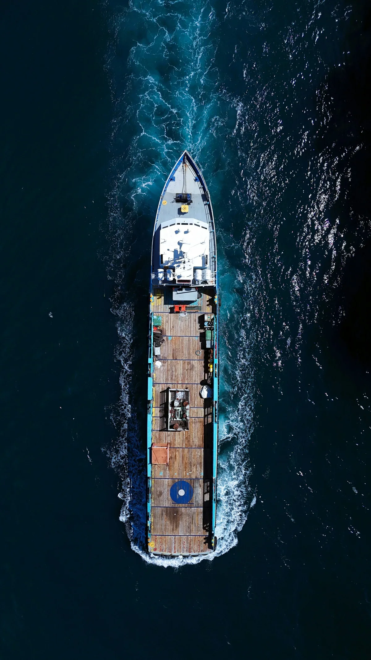 Cargo ship at sea viewed from above